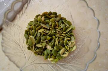 pumpkin seeds in a glass bowl