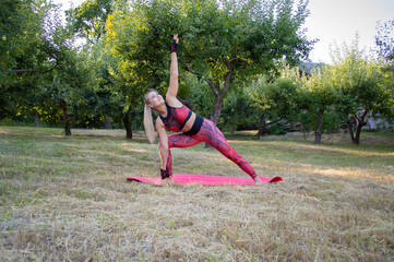 woman doing yoga exercises in the park