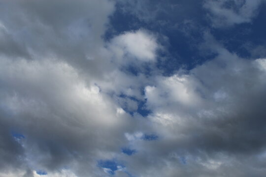 Dusk Cloudy Skies Becoming Mostly Overcast After Sunset, With Deep Blue Colors Within Denser Clouds