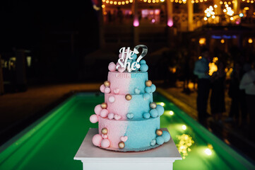 Big and delicious pink and blue baby gender reveal party cake