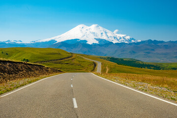 A road on the background of mountains. Highway to Elbrus, landscape. Caucasus, Russia
