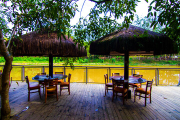 Tiki restaurant by muddy river