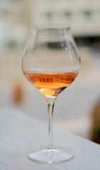 glass of rosé wine at the table outside the restaurant. Concept of luxury
