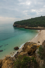 Paradise idylic Coelhos beach with turquoise water in Arrabida park, in Portugal