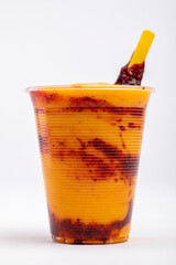 Chamoyada is a smoothie made of mango, chamoy, sugar and ice dressed with a tamarind and chile lollipop.