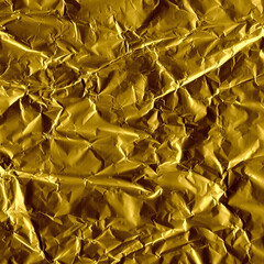 Gold shiny wall abstract background. Crumpled luxury metallic foil texture.