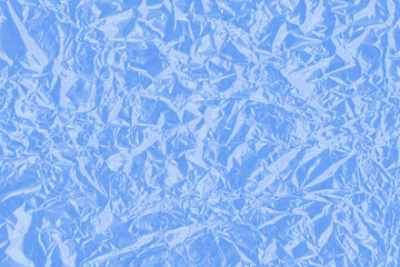 Colorful shiny wrap abstract background. Crumpled plastic texture.