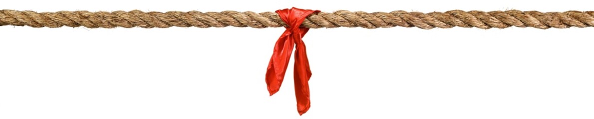 Long tug of war rope pulled tight, with red ribbon tie. Concept of conflict, competition, or...