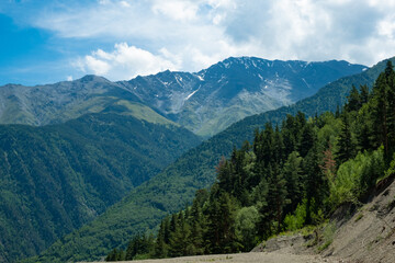 Beautiful mountain landscape with pine trees and mountain tops on a Sunny summer day, Dagestan Russia