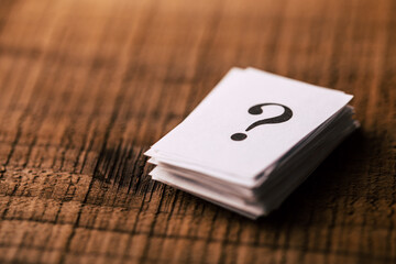 Question Mark Stack On Wooden Background
