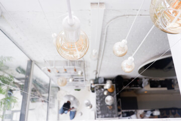 The top view of the light bulb in the white background at the coffee shop space.