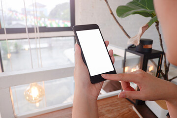 Mockup picture of business woman’s hands/man's hands holding smart phone with white blank screen...