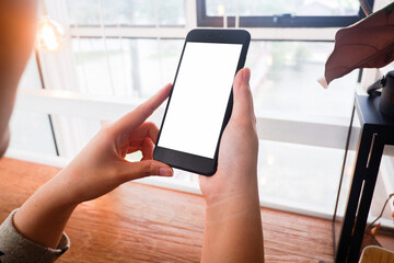Mockup picture of business woman’s hands/man's hands holding smart phone with white blank screen...