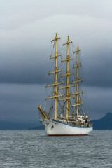 Fototapeta na wymiar at the anchorage a sailboat or other vessel is waiting out stormy weather