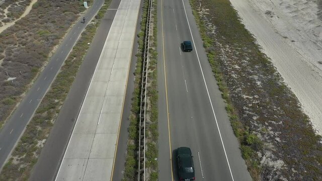 Aerial, tracking, a 1968 Camaro on the Silver Strand Boulevard, USA