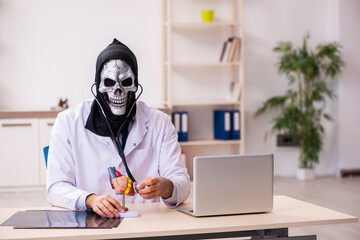 Male devil doctor working in the clinic