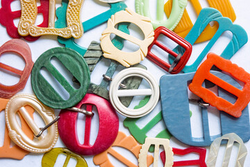 Collection of colorful retro vintage belt buckles.