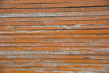 wood heap plywood texture orange paint background horizontal lines