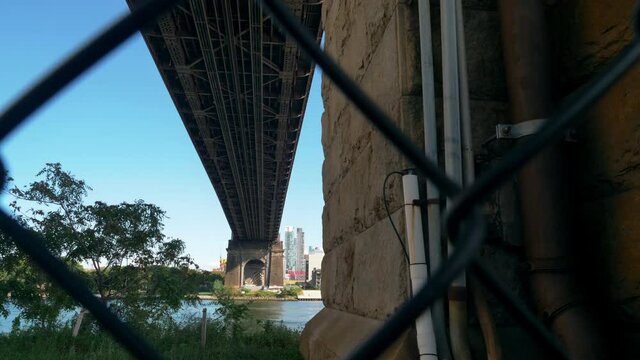 Medium, Ed Koch Queensboro Bridge viewed from behind wire fence, New York, USA