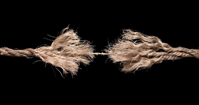 Rope frayed and ready to break apart with rope held together by a last strand ready to snap. Concept of dangerous stress or stressful situation like divorce separation, deadlines, failure, or tension.