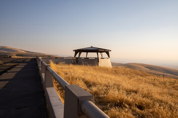 Scenic view of Prairie and stark desert landscape and a gazebo, a pavilion structure at Deadman...