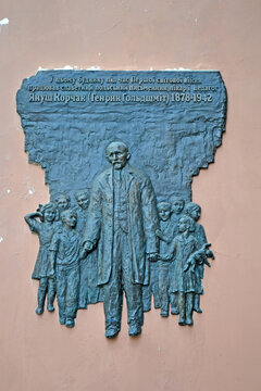 Janusz Korczak aka Henryk Goldszmit (July 22, 1878 - August 6, 1942) with Children on July 27, 2013 in Kiev, Ukraine. Memorial board on the stone wall. He died in 1942 in Treblinka extermination camp.