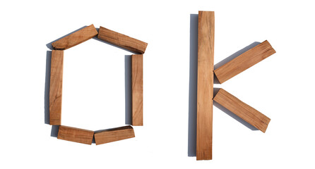 The word OK made of wood on a white background board