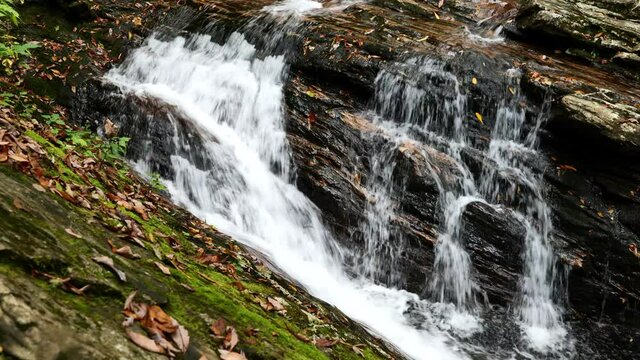 Close-up, white water on the rocks of the Skinny Dip Falls, North Carolina, USA