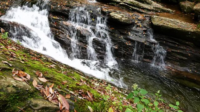 Medium, white water on the rocks of the Skinny Dip Falls, North Carolina, USA