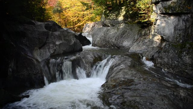 Wide, white waters of Warren Falls in autumn, Vermont, USA