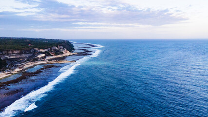 View of amazing beach with green lush tropical trees coast on Bali, Indonesia. High quality photo