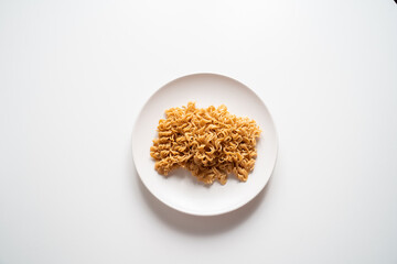 Instant noodles blanched on white plate and white background