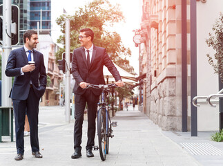 Obraz premium Two businessmen having walk