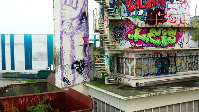 Aerial, pov, graffiti covered abandoned factory, Gent, Belgium