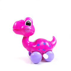   Mechanical wind up  dinosaur toy. Clockwork plastic toy isolated on white background.       