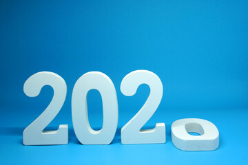 End of year 2020 number wooden object on Blue background and copy space - Happy new year 2021 - Blue new year eve celebrate concept  - Countdown from 2020 to 2021