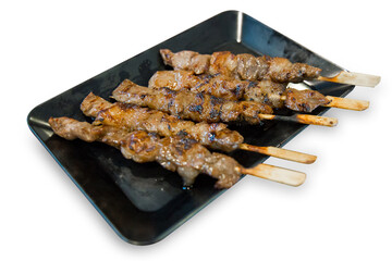 Die cut of Grilled beef on a grilled skewer on white isolated, focus selective.