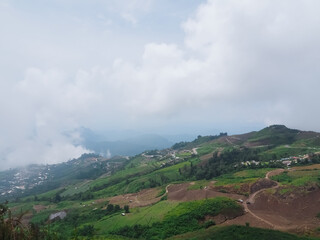 Phu Thap Berk and Khao Kho taken in a panoramic view with a view of green mountains and thick fog.