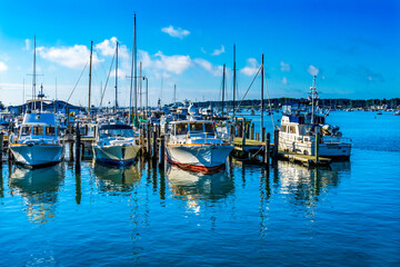 Fototapeta na wymiar Motorboats Yachts Padanaram Harbor Dartmouth Massachusetts