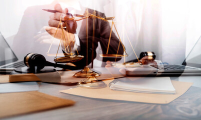 Business and lawyers discussing contract papers with brass scale on desk in office. Law, legal services, advice, justice and law concept picture with film grain effect