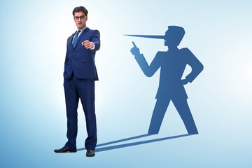 Concept of businessman liar with his shadow