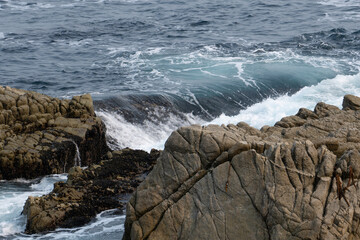 waves crashing on rocks