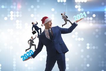 Concept of businessman in transition from 2020 to 2021