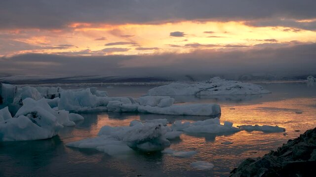 Timelapse, ice flows on the waters of Jökulsárlón Glacier Lagoon at sunset, Iceland