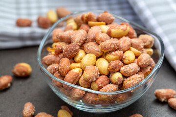 Salted peanuts in a glass bowl
