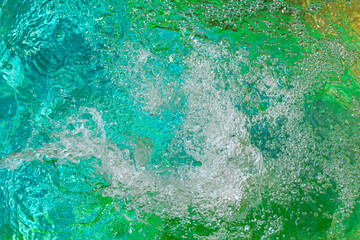 Abstract background made of white bubles on blue green aquamarine color water