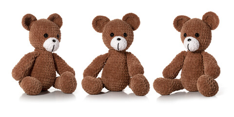 Knitted toy. Brown bear on white background. Three position. Full depth of field. With clipping path.