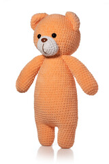 Knitted toy. Orange bear on white background. Full depth of field. With clipping path.