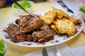 Stuffed meat with sausage and chicken.