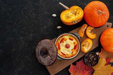 Autumn cooking. Pumpkin casserole on a white wooden background. A place for text.